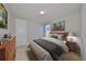 Neutral bedroom featuring a comfortable bed and wood furniture at 7010 Old Benton Dr, Apollo Beach, FL 33572