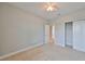 Bright bedroom with carpet, closet, ceiling fan and hall entry at 7010 Old Benton Dr, Apollo Beach, FL 33572