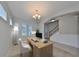 Bright home office with natural light and a view of the staircase at 7010 Old Benton Dr, Apollo Beach, FL 33572