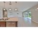 Kitchen island featuring granite countertops with a stainless steel sink and faucet at 7010 Old Benton Dr, Apollo Beach, FL 33572