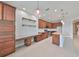 Modern kitchen featuring a granite island, extensive cabinetry, and stainless steel appliances at 7010 Old Benton Dr, Apollo Beach, FL 33572