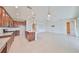 Open concept kitchen and living area, complete with granite island and stainless appliances at 7010 Old Benton Dr, Apollo Beach, FL 33572