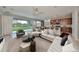 Bright living room with large sliding glass doors offering views of the outdoor space at 7010 Old Benton Dr, Apollo Beach, FL 33572