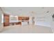 Bright, open-concept living room with modern finishes, wood-look floors, and ample natural light at 7010 Old Benton Dr, Apollo Beach, FL 33572