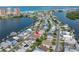 Aerial view of waterfront neighborhood, offering coastal living and water access at 704 180Th E Ave, Redington Shores, FL 33708