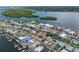 Coastal homes in community with canal access, lush landscaping, and serene waterfront views at 704 180Th E Ave, Redington Shores, FL 33708