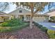 Charming home featuring a well-manicured front yard and two-car garage at 7211 Bowspirit Pl, Apollo Beach, FL 33572