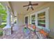 Cozy front porch with comfortable seating and stylish brick flooring at 7211 Bowspirit Pl, Apollo Beach, FL 33572