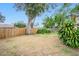 Expansive backyard with mature trees, privacy fence, and lush greenery, offering a serene outdoor retreat at 7281 61St N Ave, St Petersburg, FL 33709