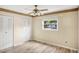 Cozy bedroom with wood-look flooring, ceiling fan, closet and natural light at 7281 61St N Ave, St Petersburg, FL 33709