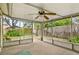 The screened lanai offers seamless outdoor enjoyment with views of the fenced yard and lush landscaping at 7281 61St N Ave, St Petersburg, FL 33709