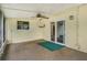 Enclosed lanai featuring a ceiling fan, textured walls, and sliding glass doors to blend indoor and outdoor living at 7281 61St N Ave, St Petersburg, FL 33709