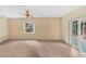 Bright living area with tile flooring and sliding glass doors to the lanai at 7281 61St N Ave, St Petersburg, FL 33709