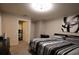 Bedroom with neutral walls, walk in closet, and a comfortable striped bed at 8010 Bally Money Rd, Tampa, FL 33610