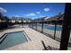A gated community pool with a hot tub surrounded by townhomes offering a recreational outdoor space at 8010 Bally Money Rd, Tampa, FL 33610