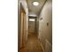 Tiled hallway featuring neutral walls, white doors, and natural lighting, perfect for a welcoming entrance at 8010 Bally Money Rd, Tampa, FL 33610