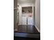 Laundry closet features modern appliances and convenient shelving at 8010 Bally Money Rd, Tampa, FL 33610