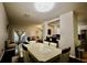 Open concept living space featuring a living room, dining area, and kitchen with bar seating at 8010 Bally Money Rd, Tampa, FL 33610