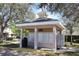 Community mail kiosk surrounded by trees on a sunny day at 8010 Bally Money Rd, Tampa, FL 33610