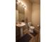 Powder room with a pedestal sink, toilet, and tile flooring, offering a convenient space for guests at 8010 Bally Money Rd, Tampa, FL 33610