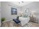 Bedroom with natural light, a ceiling fan, and a cozy rug at 8161 Lago Mist Way, Wesley Chapel, FL 33545