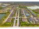 Aerial view of the neighborhood featuring lakes and beautiful landscaping at 9033 Aspen Hollow Pl, Riverview, FL 33578