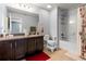 Bathroom showcasing a vanity, sink, and a shower-tub combo with neutral decor at 9033 Aspen Hollow Pl, Riverview, FL 33578