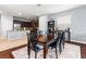 Elegant dining room with a large table and an open view into the well-lit kitchen at 9033 Aspen Hollow Pl, Riverview, FL 33578