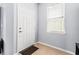 Inviting entryway with a white door and a window allowing natural light to filter in at 9033 Aspen Hollow Pl, Riverview, FL 33578