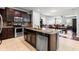 Modern kitchen featuring stainless steel appliances and a large island at 9033 Aspen Hollow Pl, Riverview, FL 33578