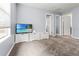 Bright living room featuring three white storage benches below the TV set at 9033 Aspen Hollow Pl, Riverview, FL 33578