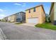 Street view of homes with garages and nicely manicured lawns at 9033 Aspen Hollow Pl, Riverview, FL 33578