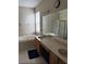 Spacious bathroom features a large soaking tub and a double sink vanity with great lighting at 9729 Asbel Estates St, Land O Lakes, FL 34638