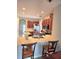 Well-equipped kitchen features stainless steel appliances, a spacious island, and ample cabinet storage at 9729 Asbel Estates St, Land O Lakes, FL 34638