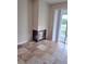 Cozy living room with a tiled fireplace and sliding glass doors leading to the outdoors at 9729 Asbel Estates St, Land O Lakes, FL 34638