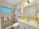 Updated bathroom with a tiled shower, modern fixtures, and a bright, airy feel at 9737 36Th N Way, Pinellas Park, FL 33782