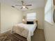 Bedroom with a bed styled with decorative pillows, natural light from a window, and neutral tones at 9737 36Th N Way, Pinellas Park, FL 33782