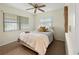Bedroom with an area rug, styled bed with decorative pillows, and sunlight coming through windows with blinds at 9737 36Th N Way, Pinellas Park, FL 33782