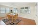 Sunlit dining area with bright windows, wood table and chairs, and neutral decor at 9737 36Th N Way, Pinellas Park, FL 33782
