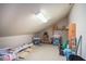 A spacious attic area with unique ceiling architecture and ample storage options at 10129 Paddock Oaks Dr, Riverview, FL 33569