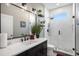 Bathroom featuring a glass shower and a black vanity at 10129 Paddock Oaks Dr, Riverview, FL 33569