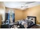 Bedroom with neutral walls, ceiling fan, and dark wood flooring at 10129 Paddock Oaks Dr, Riverview, FL 33569
