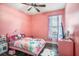 Pink themed bedroom with character bedding and a ceiling fan at 10129 Paddock Oaks Dr, Riverview, FL 33569