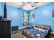 Blue themed bedroom with a ceiling fan at 10129 Paddock Oaks Dr, Riverview, FL 33569