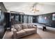 A spacious game room with a cozy couch, pool table, and basketball game at 10129 Paddock Oaks Dr, Riverview, FL 33569