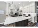 Bright, open kitchen features a large island, stainless steel appliances, and custom cabinetry at 10129 Paddock Oaks Dr, Riverview, FL 33569