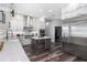 Modern kitchen features a large island, stainless steel appliances, wine cooler and white custom cabinetry at 10129 Paddock Oaks Dr, Riverview, FL 33569