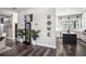 Bright, open floor plan to kitchen with modern décor and plants accenting the beautiful laminate floors at 10129 Paddock Oaks Dr, Riverview, FL 33569