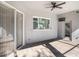 A covered patio with tile flooring and a sliding door to the home at 10129 Paddock Oaks Dr, Riverview, FL 33569