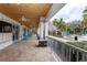 Covered clubhouse patio featuring stone columns and open views of the pool at 10812 Applewood Range Way, Tampa, FL 33647